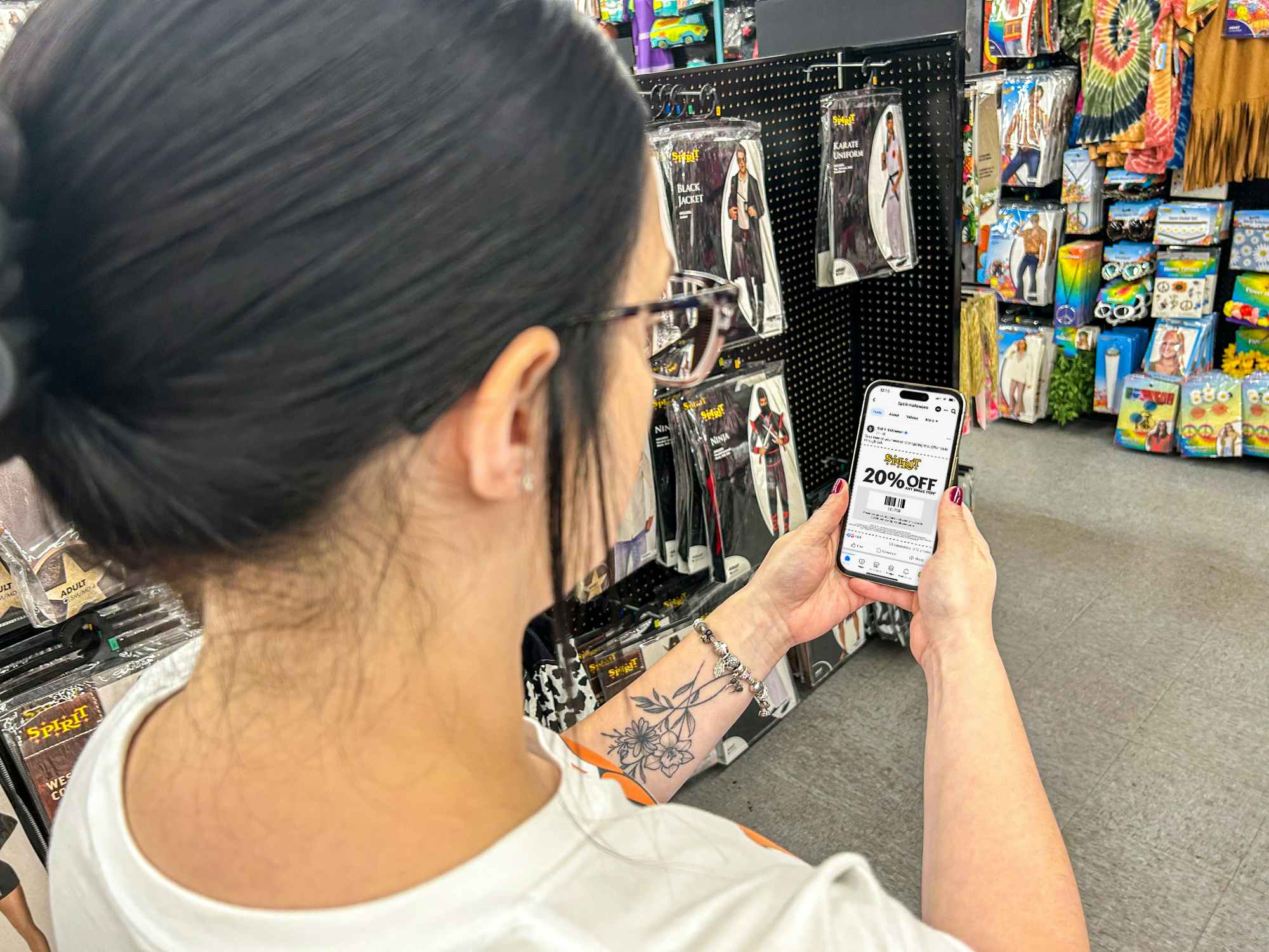 a person looking at a spirit halloween coupon on their phone