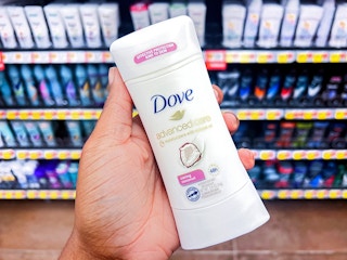 person holding a dove advanced care stick in caring coconut