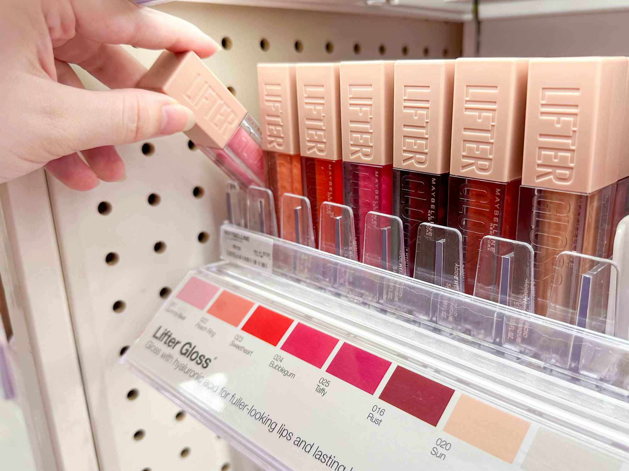 Someone shopping for Maybelline Lifter Gloss at the store