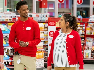 Target employees talking and walking inside Target