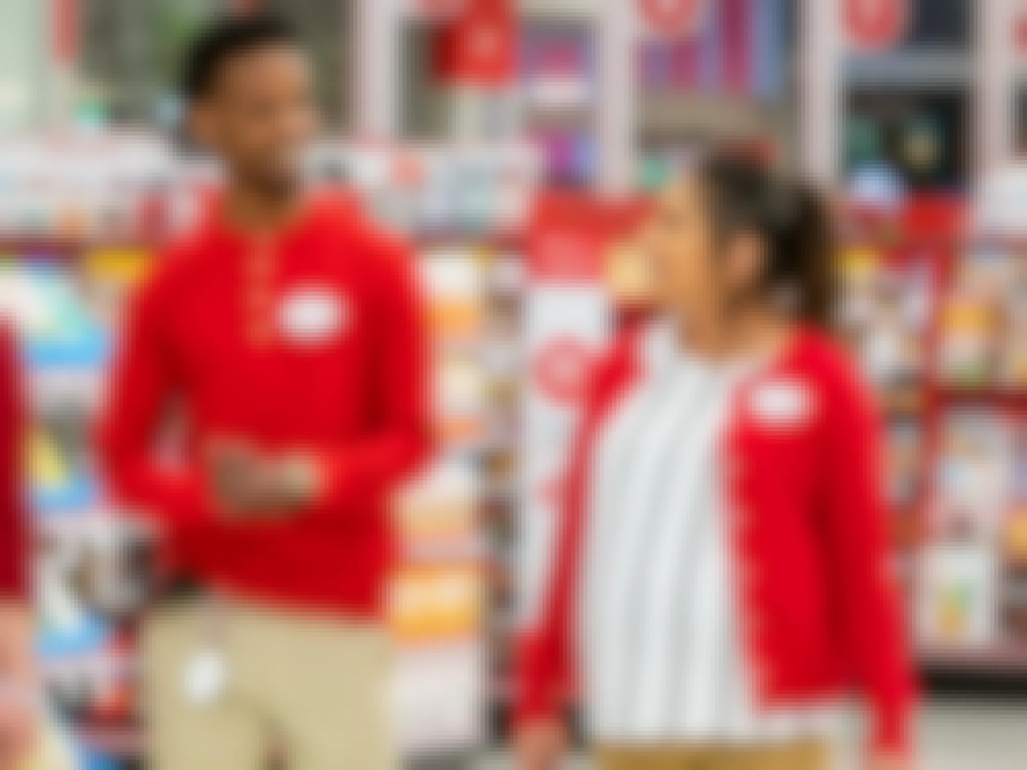 Target employees talking and walking inside Target