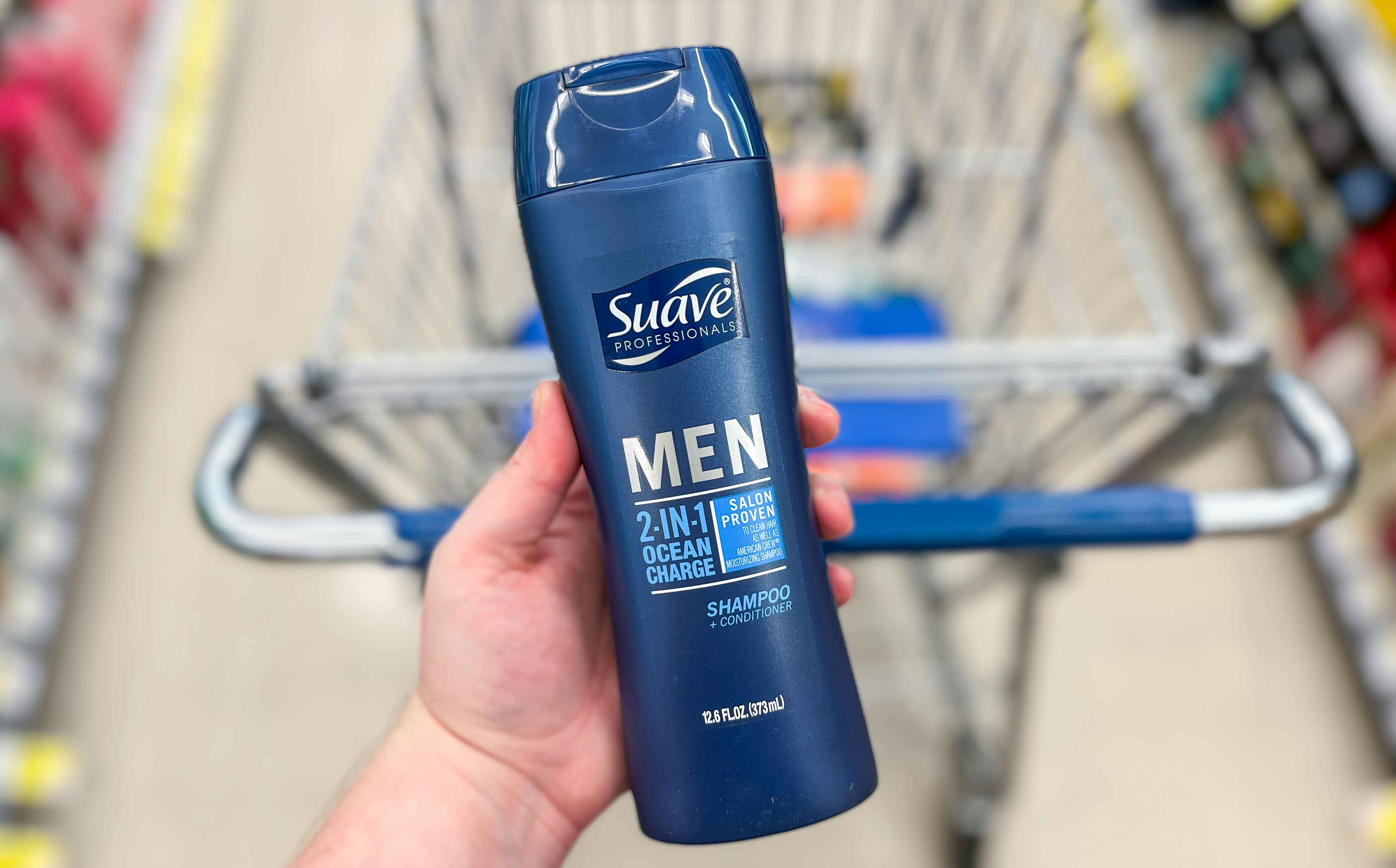 hand holding suave shampoo hair care