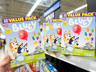 Someone shopping for Bluey fruit snacks at Walmart