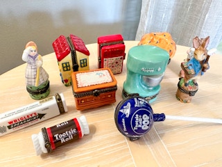 A group of porcelain hinged boxes together on a table