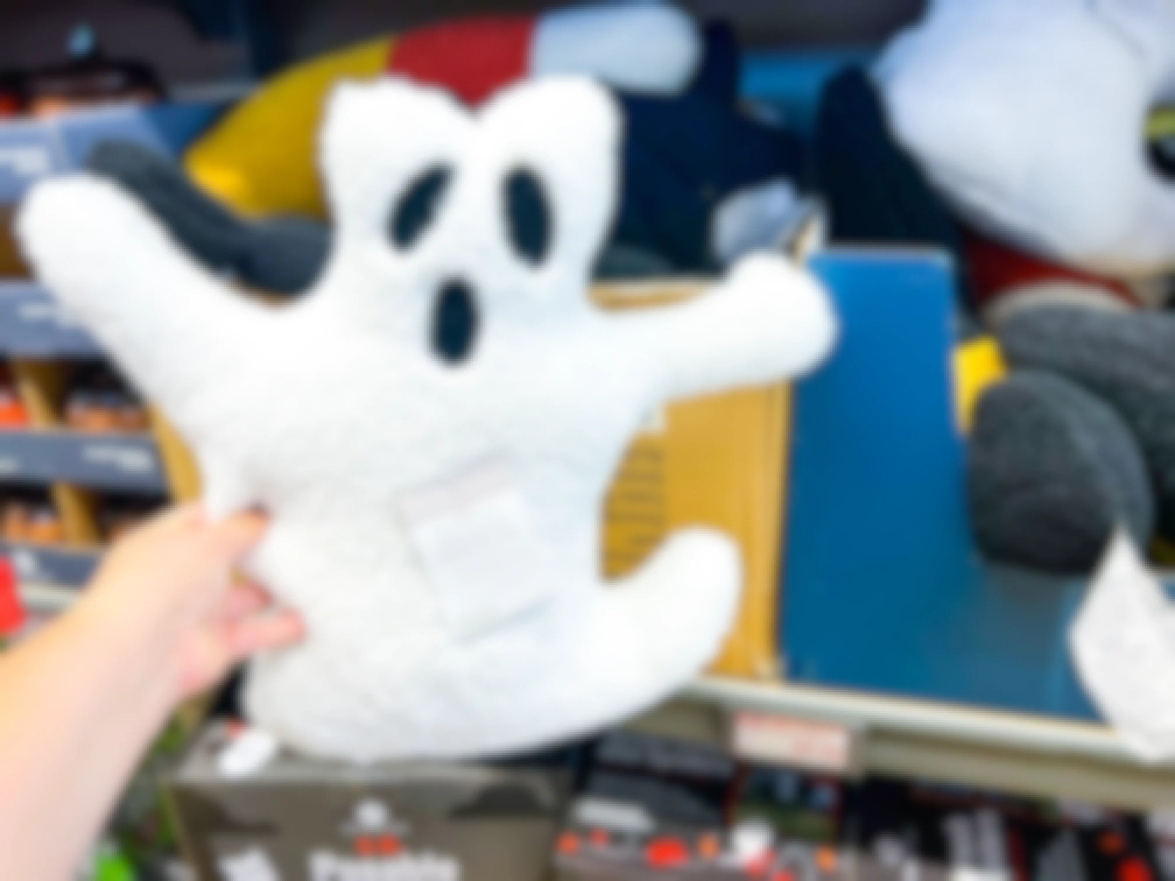 hand holding a stuffed Ghost 