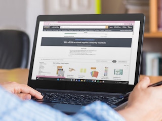 a person on a laptop with amazon back to school on screen