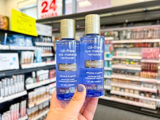 hand holding two bottles of Neutrogena oil free eye makeup remover