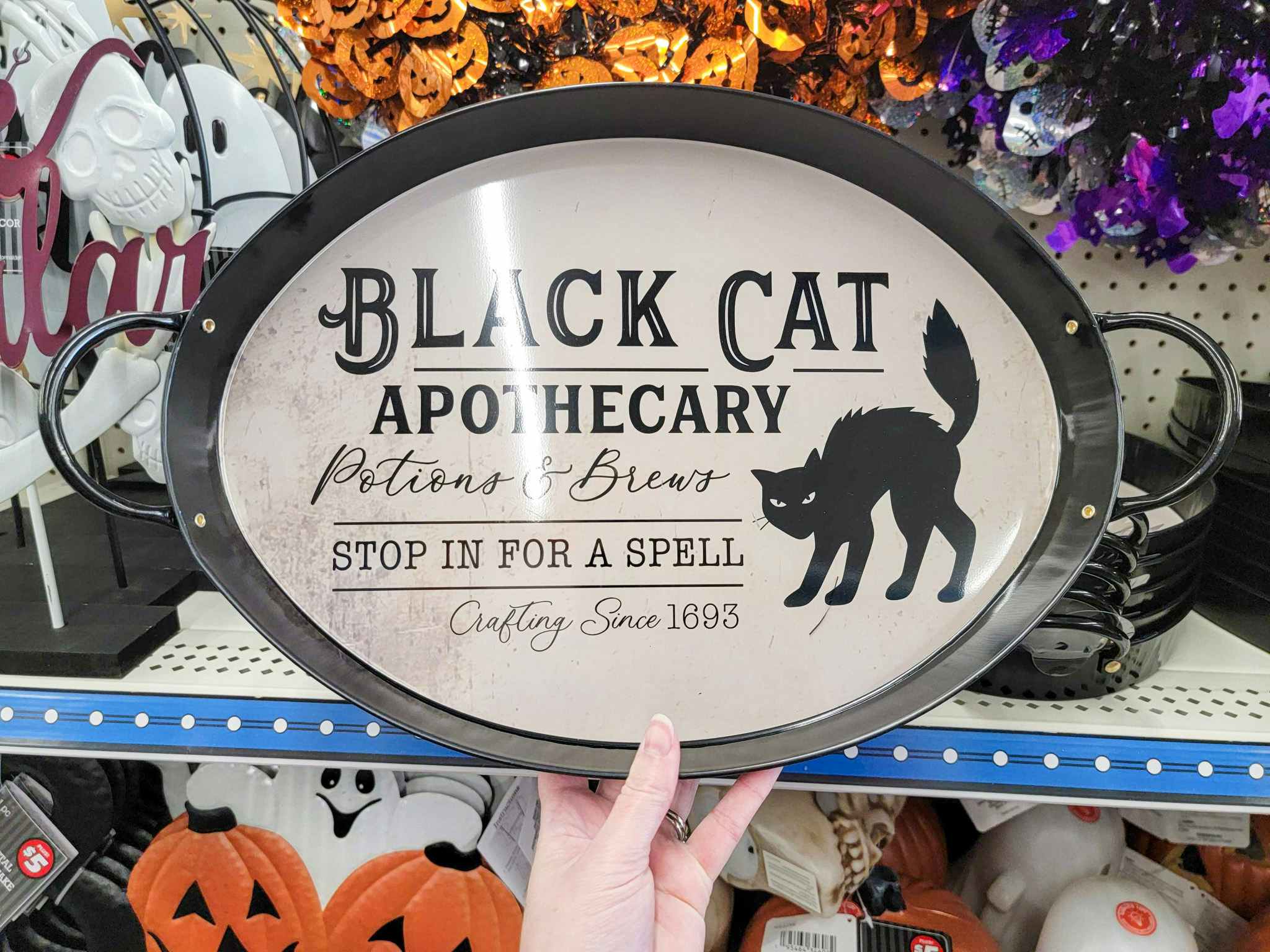 serving tray that says "black cat apothecary