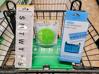 pill organizers in a cart