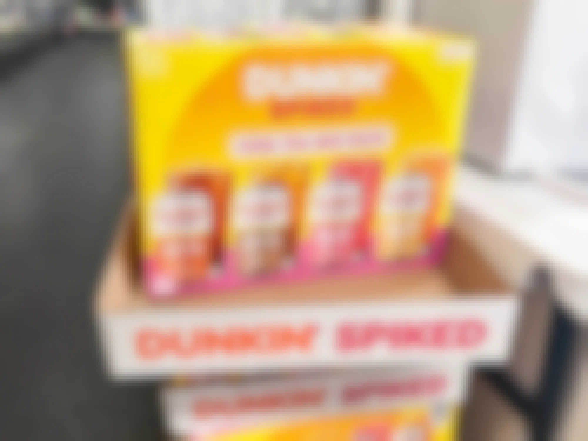 cases of Dunkin Spiked iced tea stocked at a liquor store