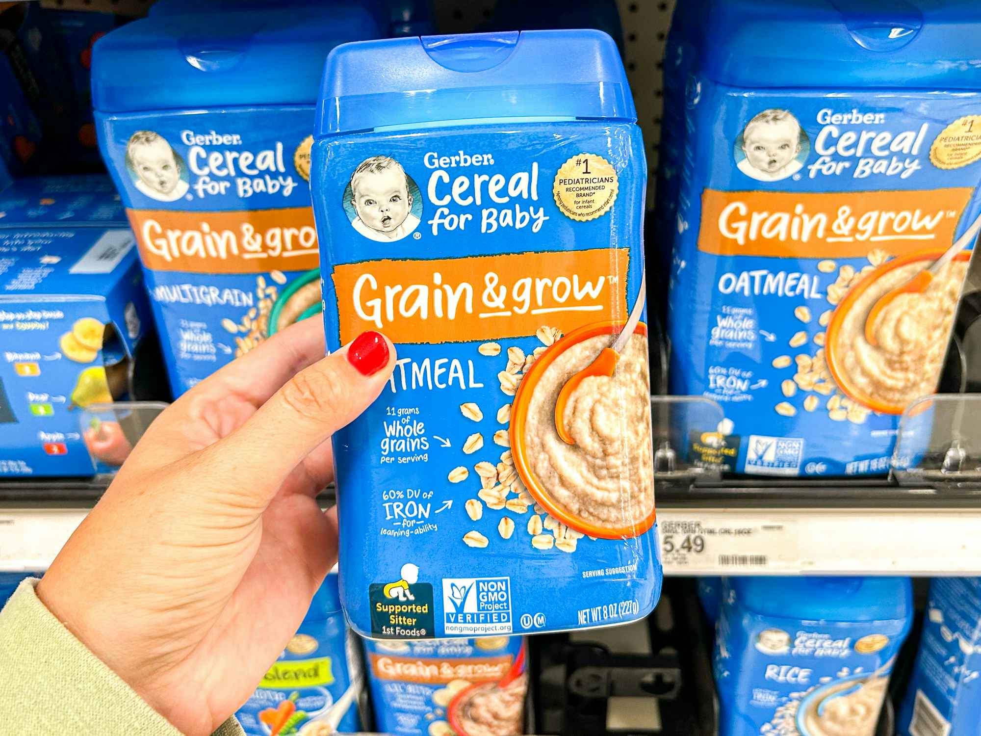 a hand holding up grain and grow gerber oatmeal at target