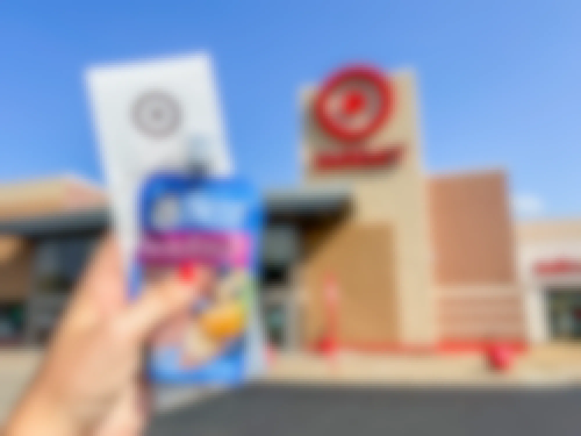a person holding up gerber baby food with a receipt in front of the target sign