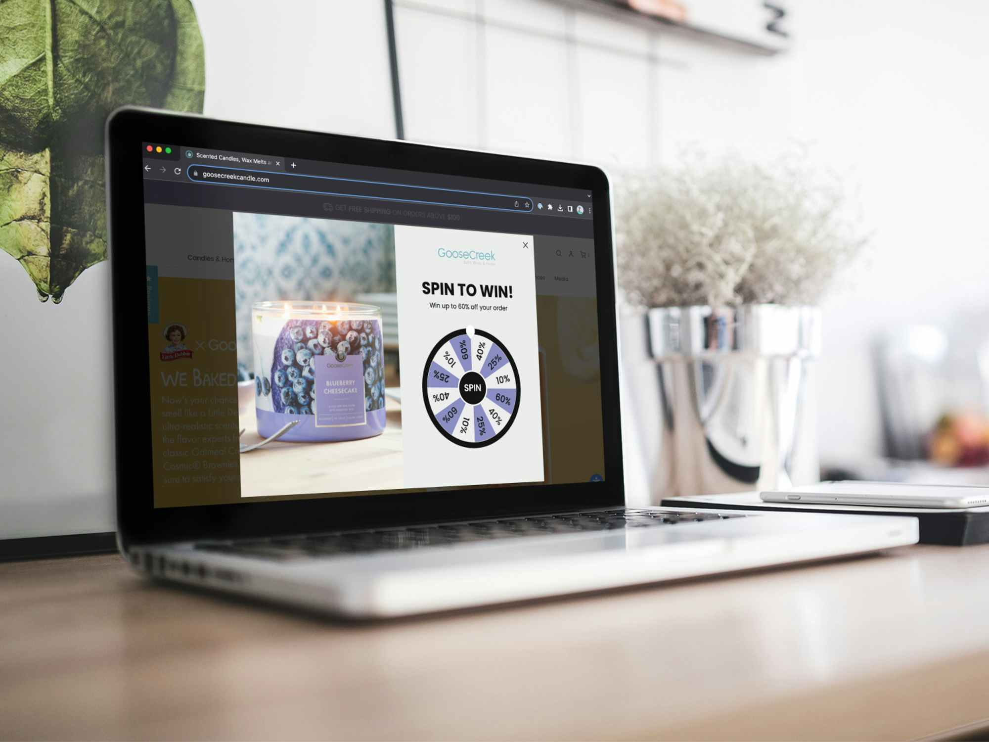 a laptop displaying the spinning wheel of discounts on the GooseCreek website