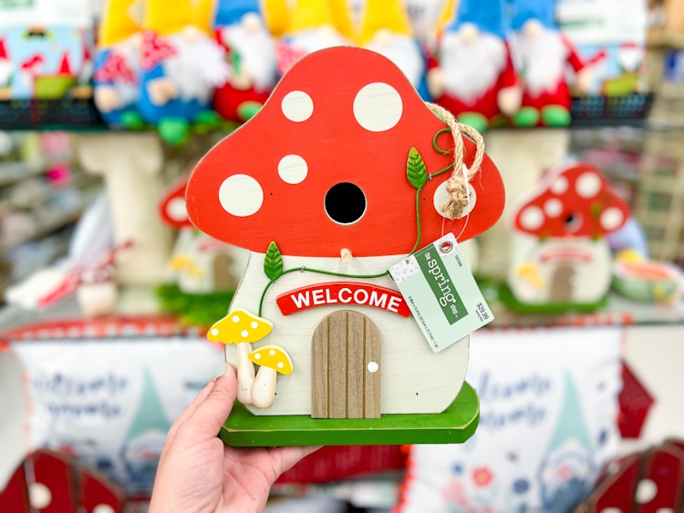 a birdhouse in the shape of a mushroom