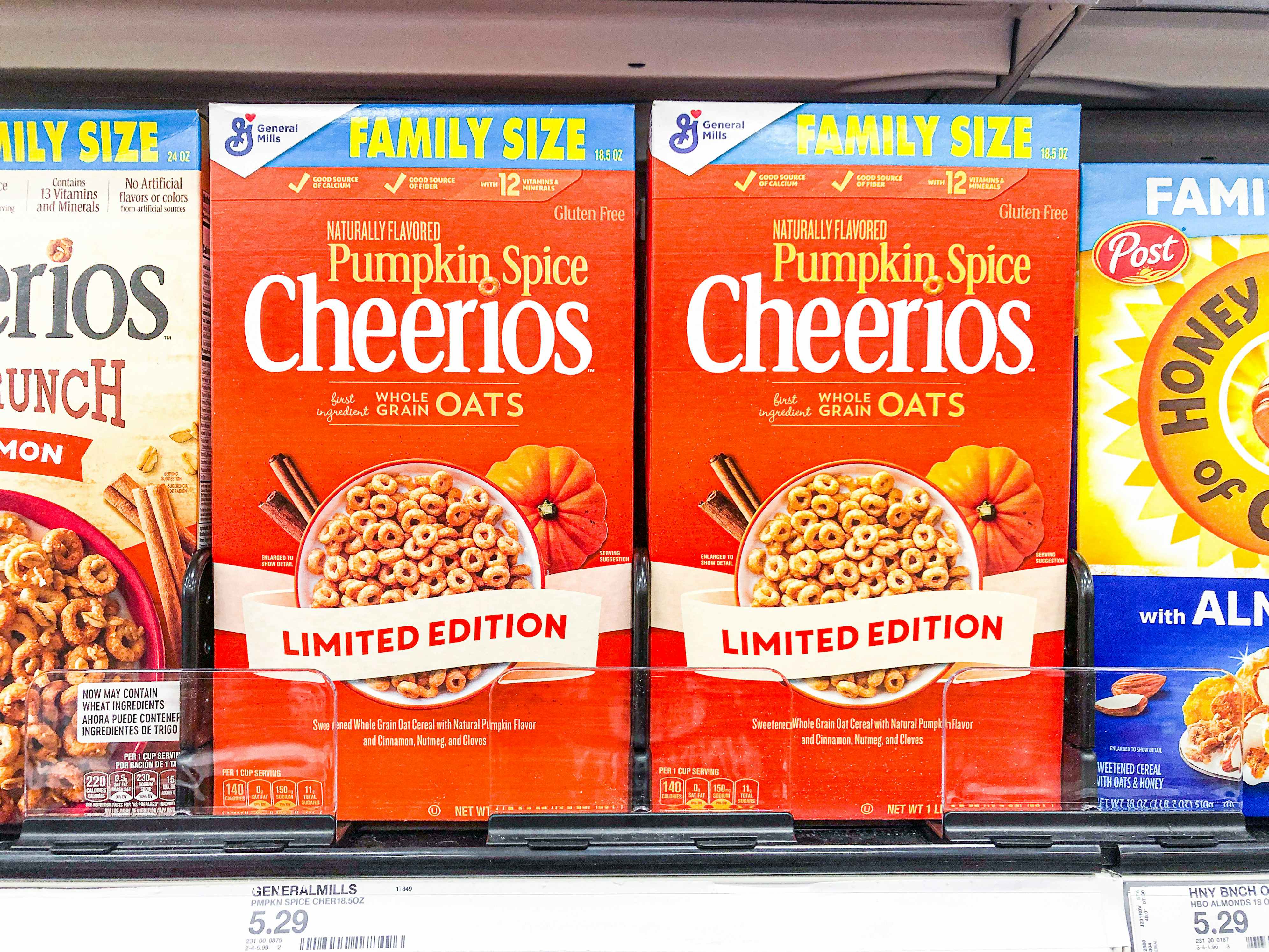 Two boxes of family size pumpkin spice cheerios on the shelf at Target