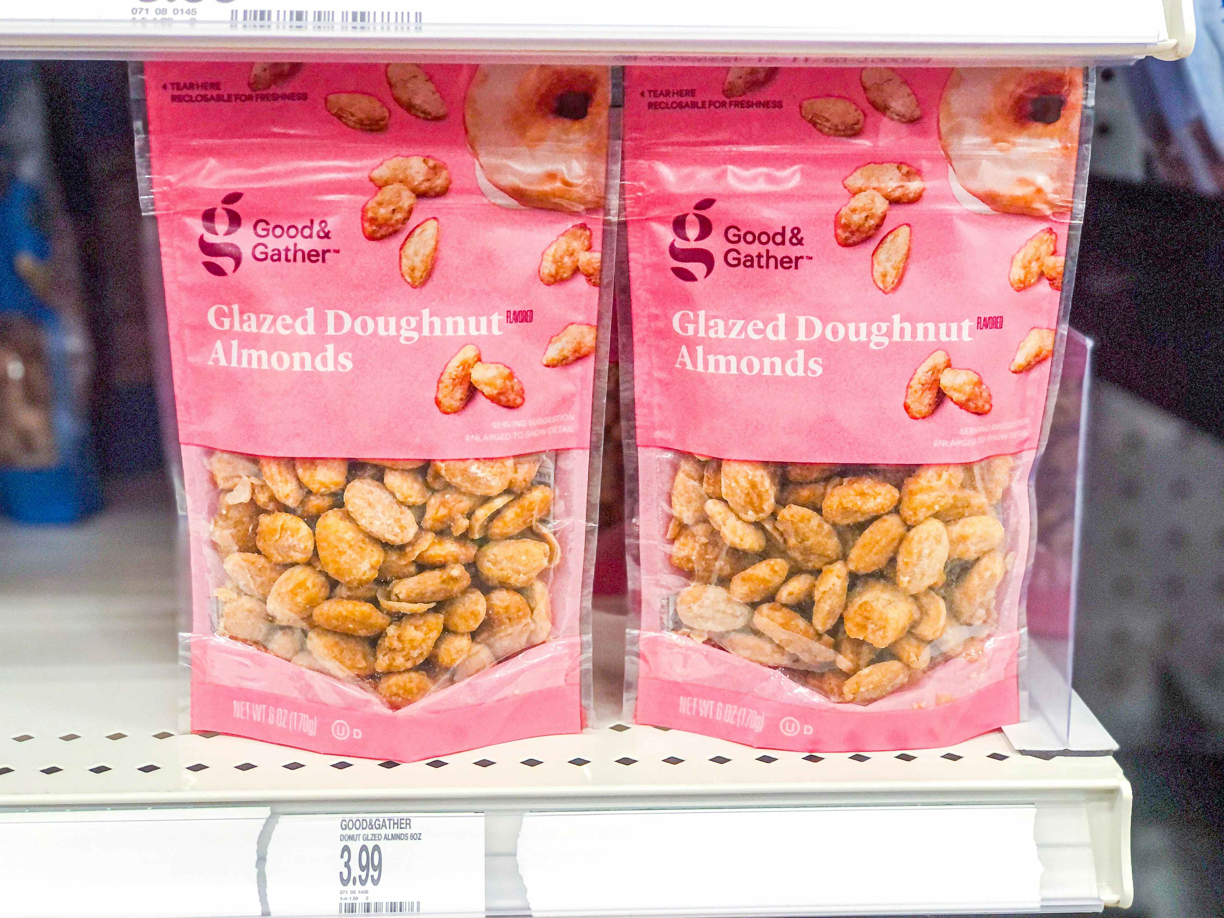 Two bags of Favorite Day Glazed Doughnut Almonds on the shelf at Target