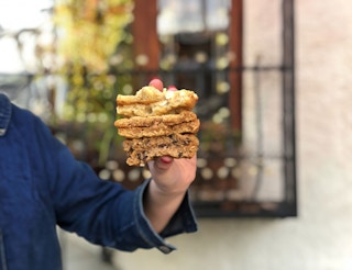 hand holding a stack of cookies