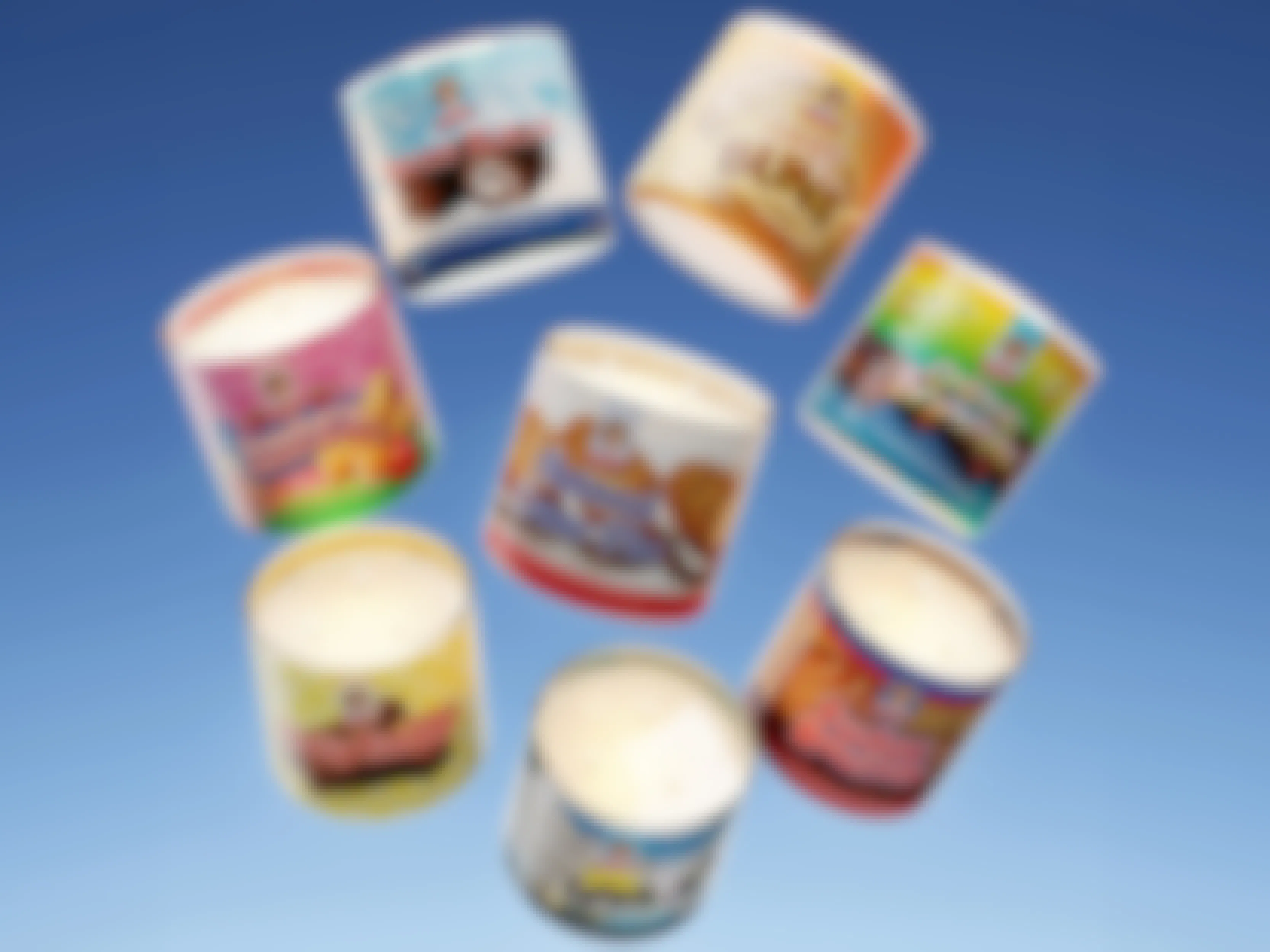 some Little Debbie snack scented candles on a blue background
