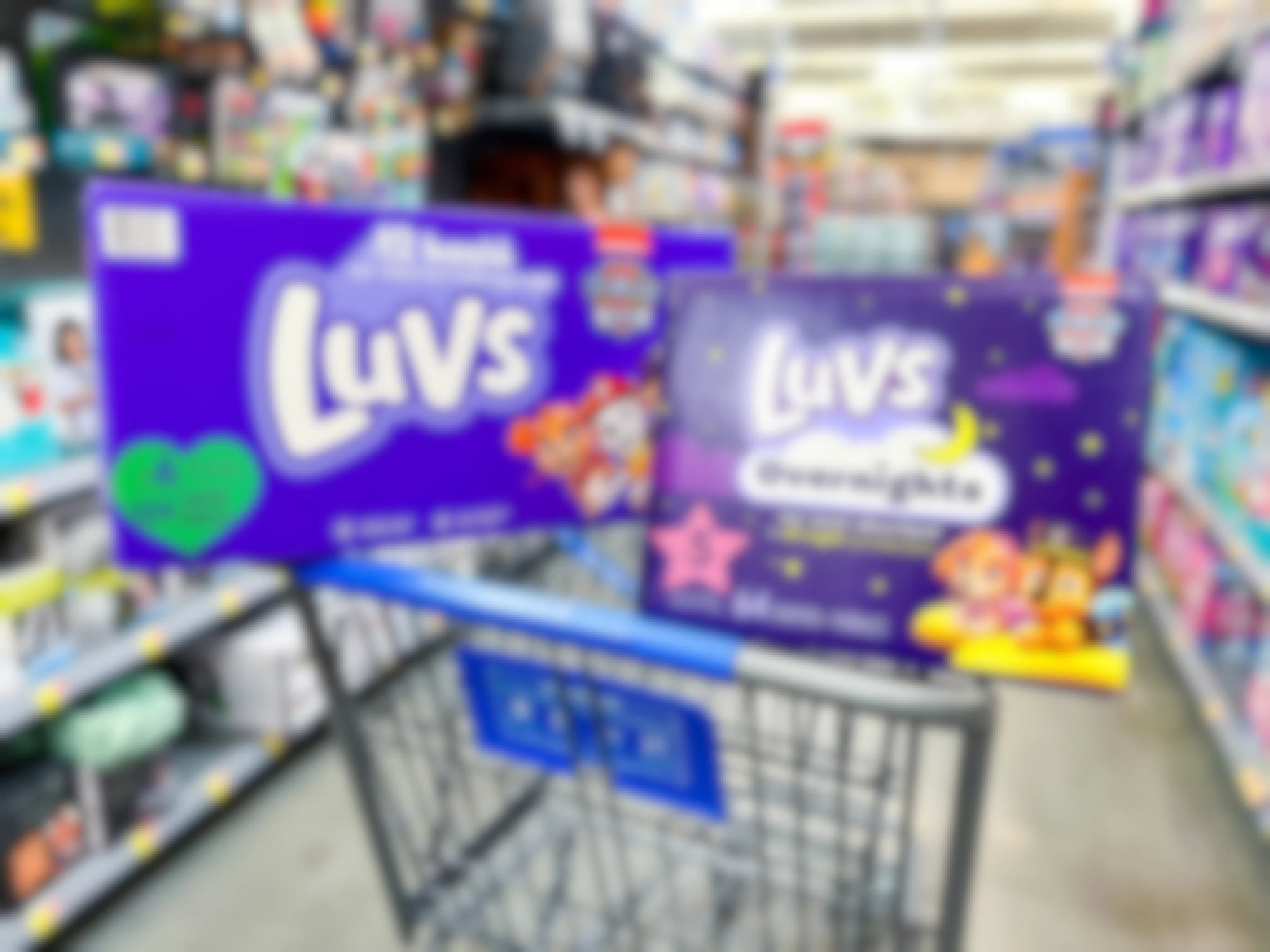 Big boxes of luvs overnight size 5 and luvs diapers size 6 in cart
