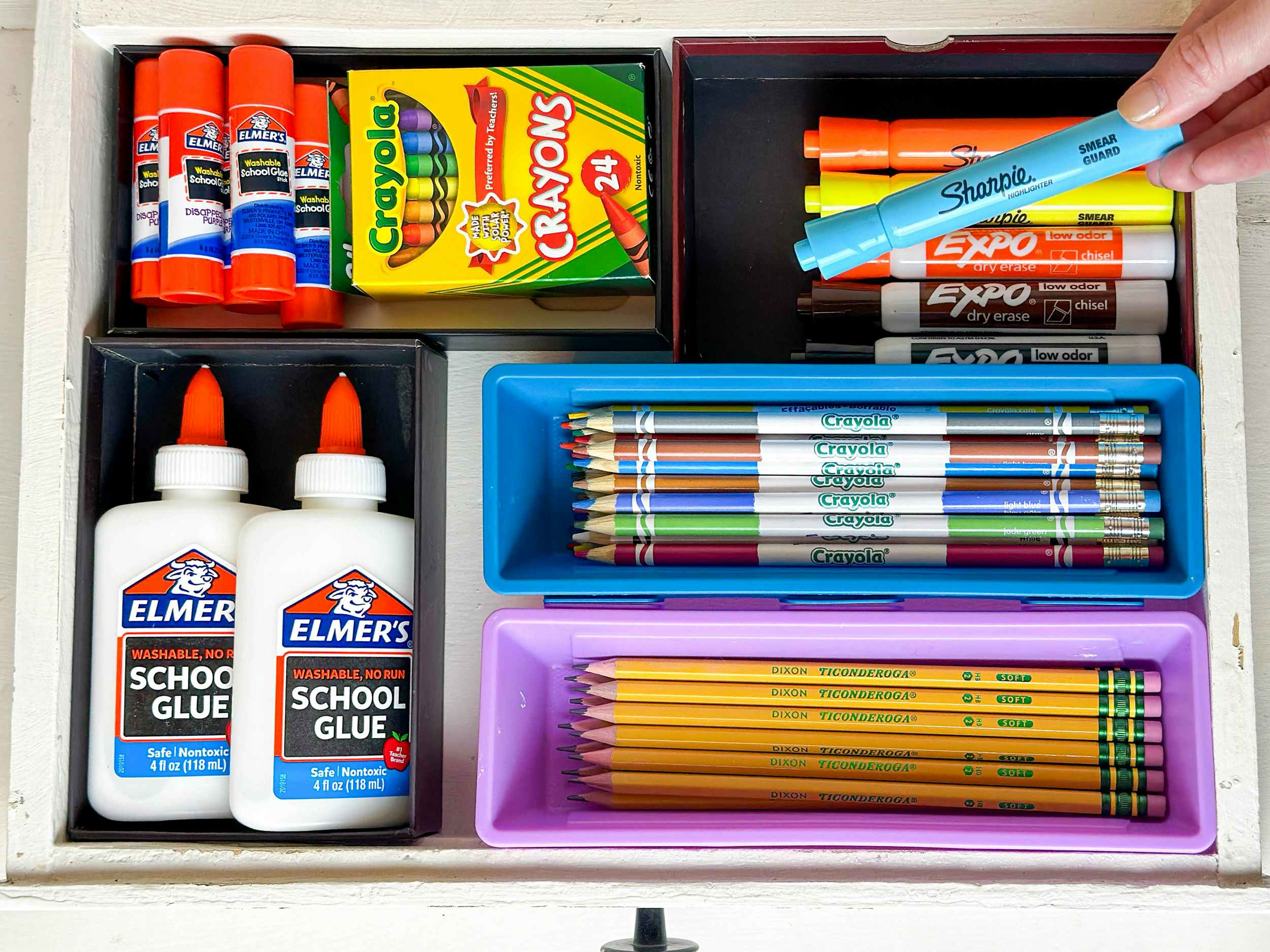 a drawer filled with orgainzed school supplies