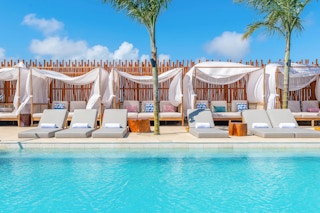 Cabanas along the side of a pool