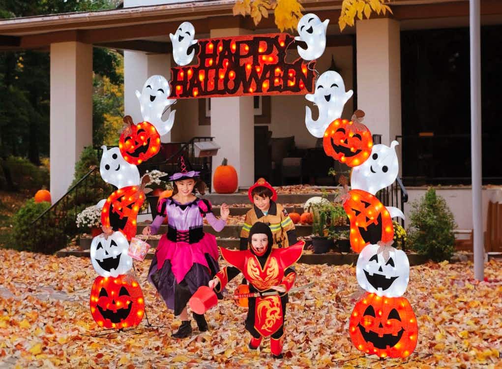 Three kids dressed in halloween costumes