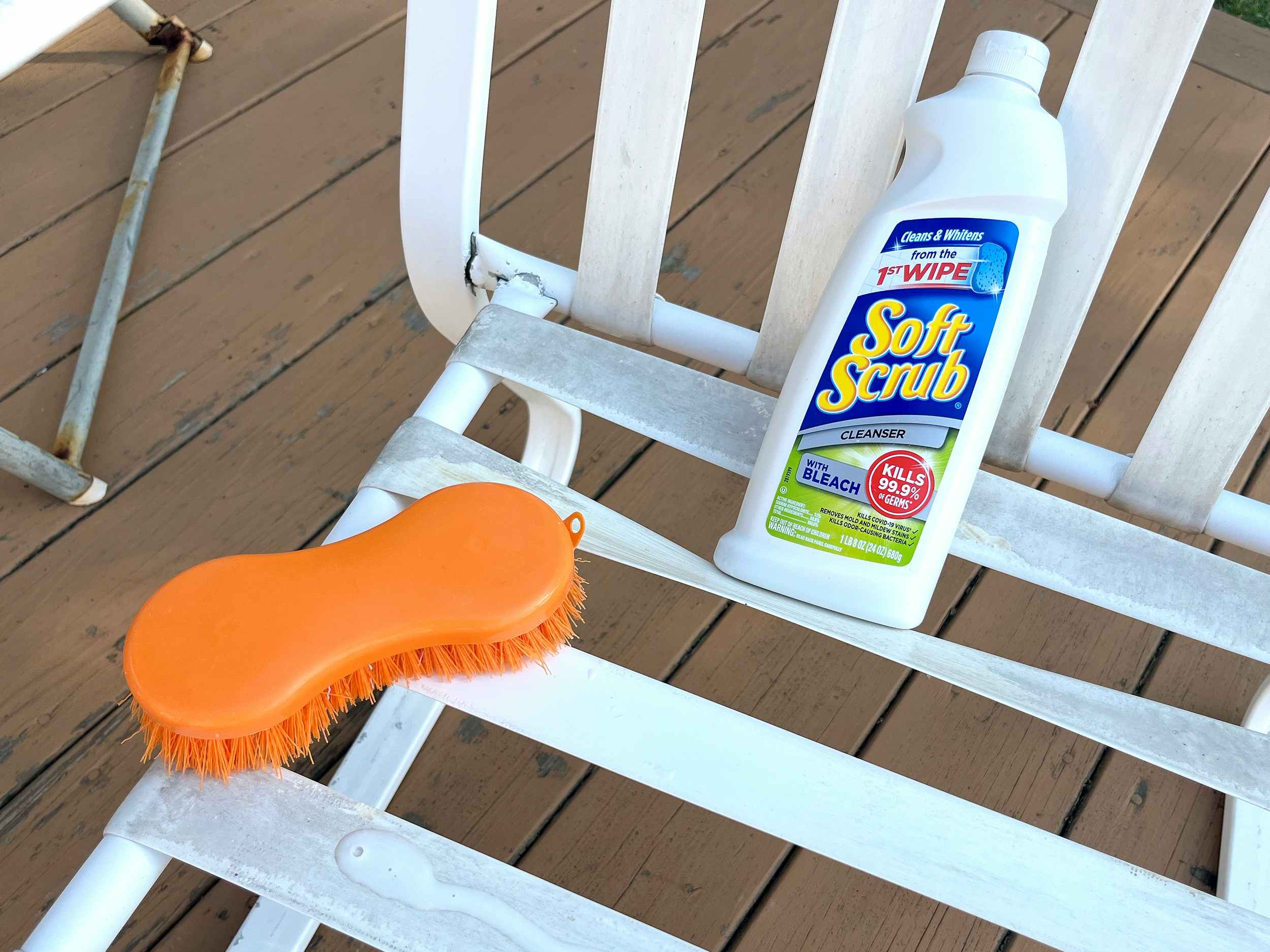 soft scrub cleanser with bleach and scrub brush on vinyl patio furniture