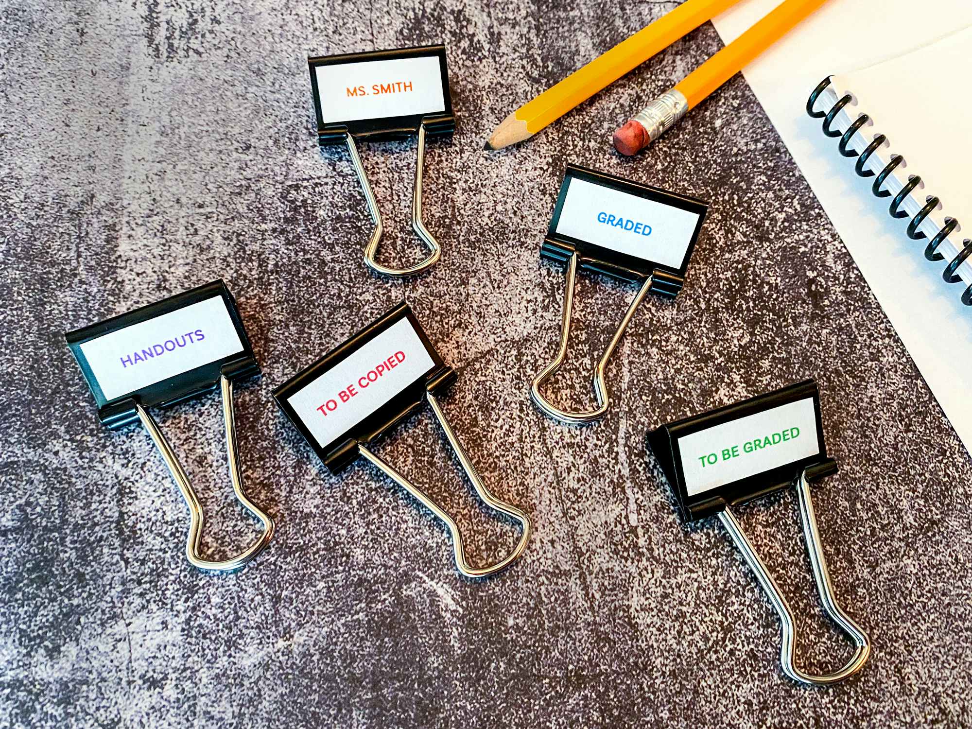 pencils and labeled binder clips for schoolwork organization