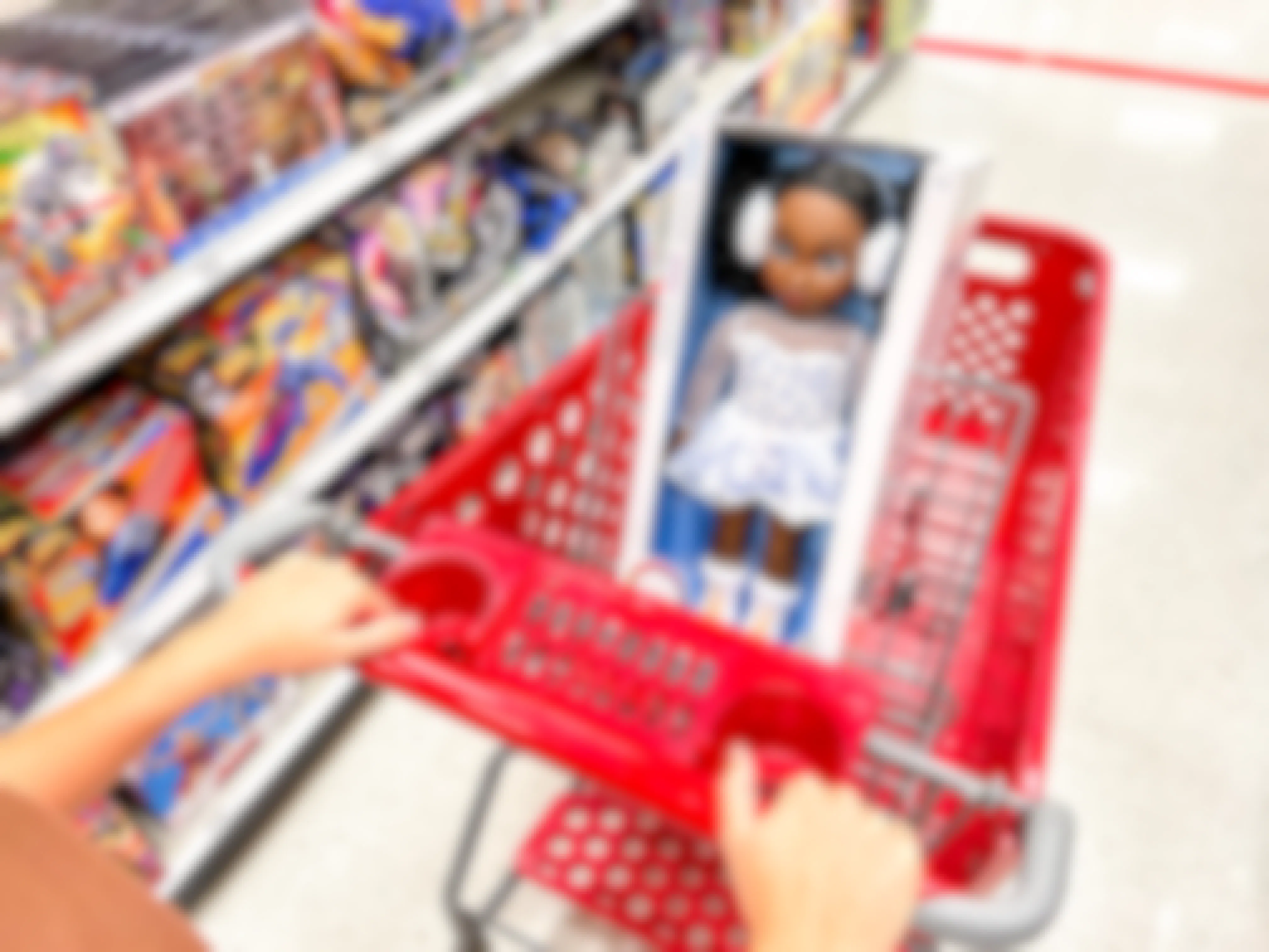 a person pushing a disney doll in a target cart