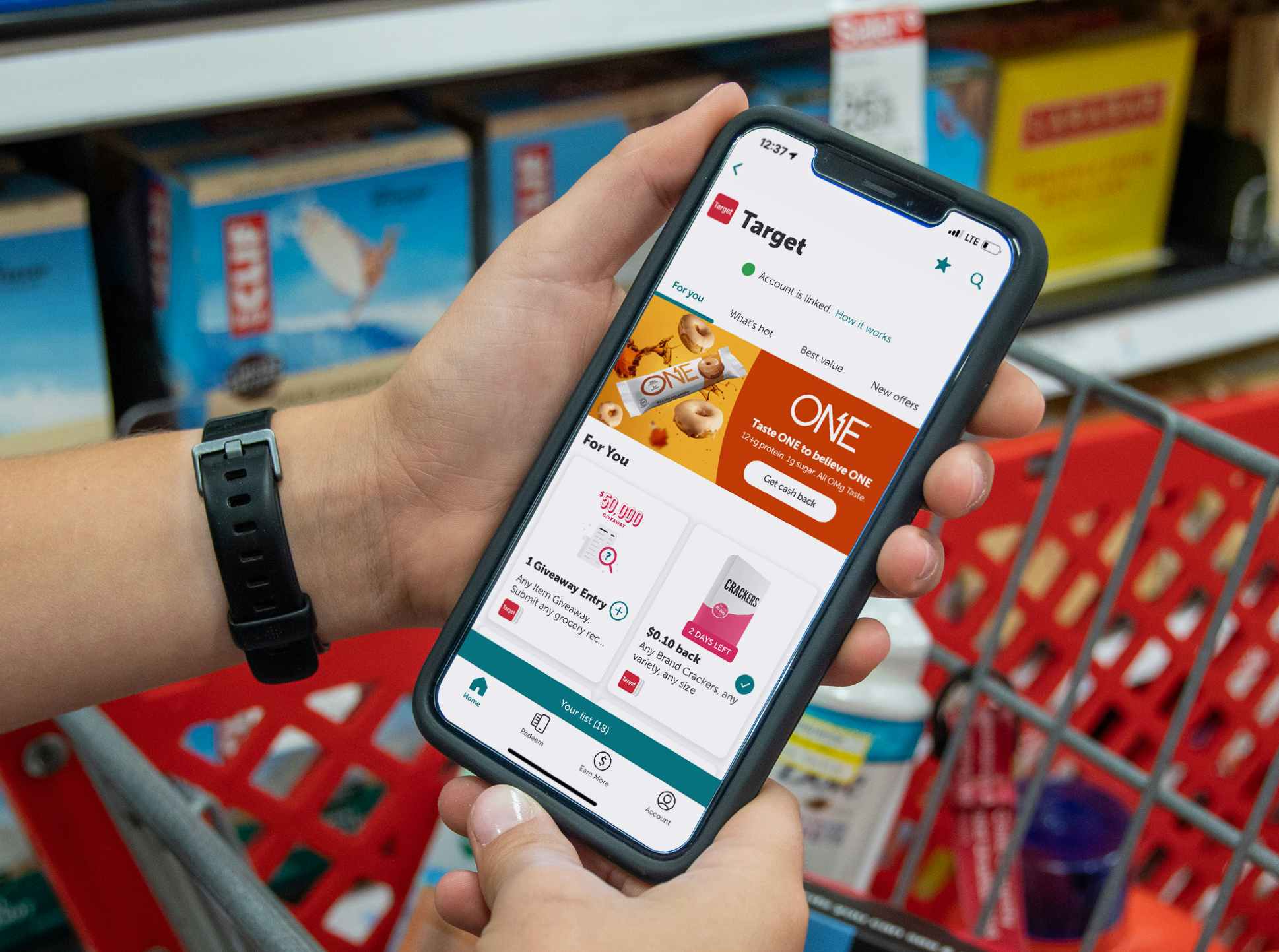 a woman's hands holding a cell phone looking at Ibotta deals for Target in the Ibotta app