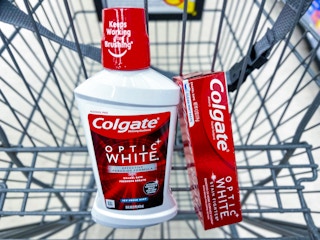 a tube of colgate toothpaste and a bottle of colgate mouthwash