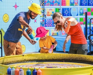 a family doing a paint activity at Walmart Rewind