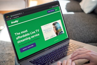 Someone using a laptop looking at the Frndly page