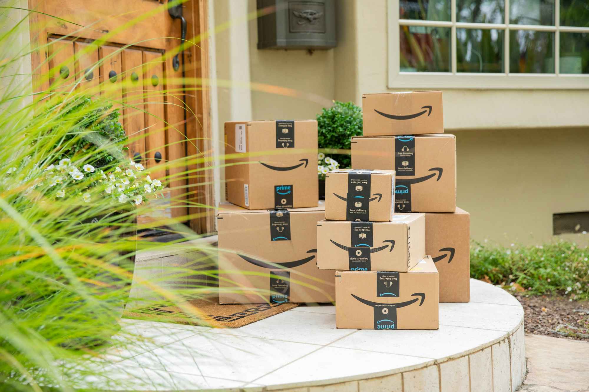 amazon boxes sitting on a front porch