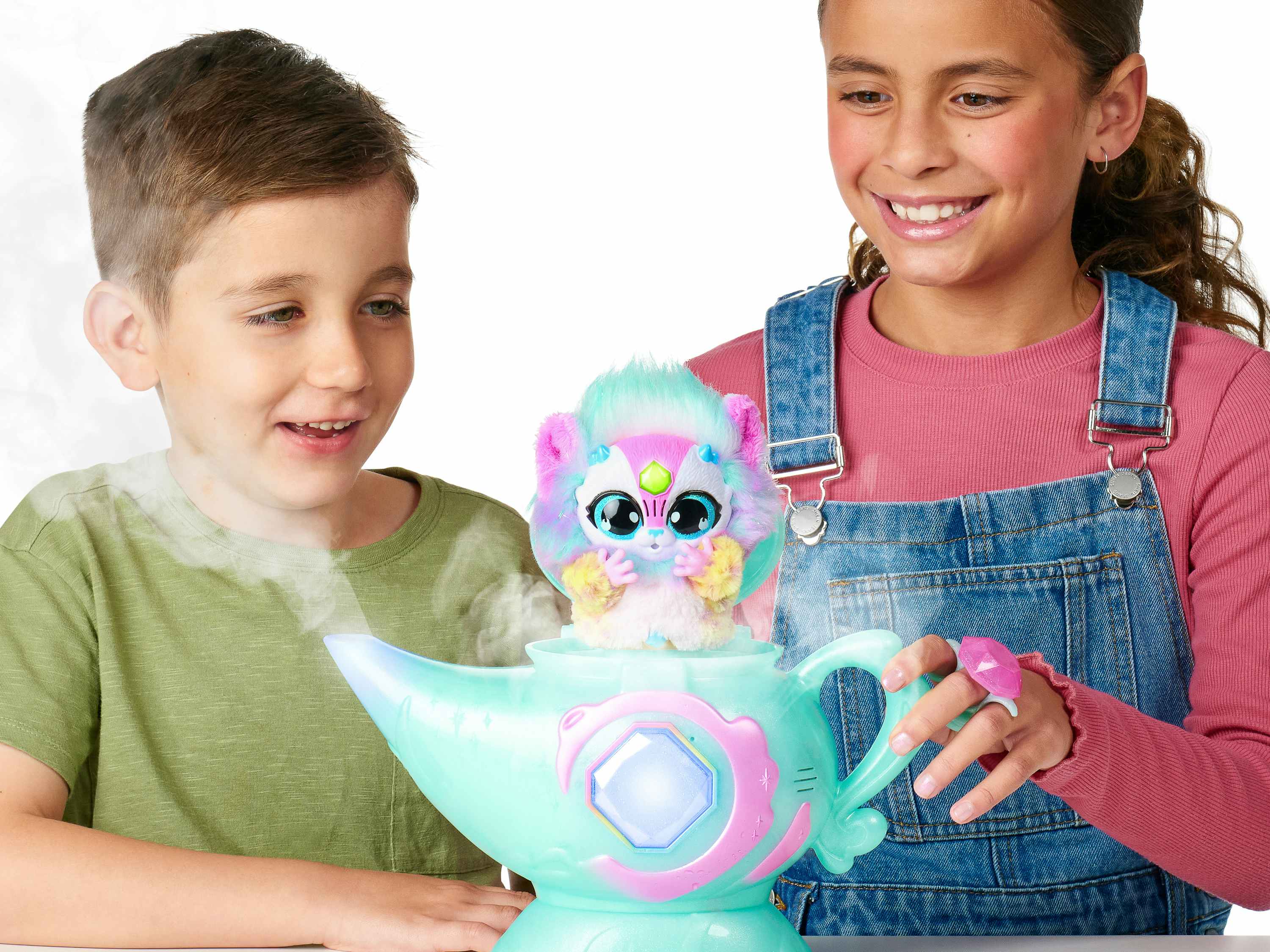 two kids playing with a Magic Mixies lamp