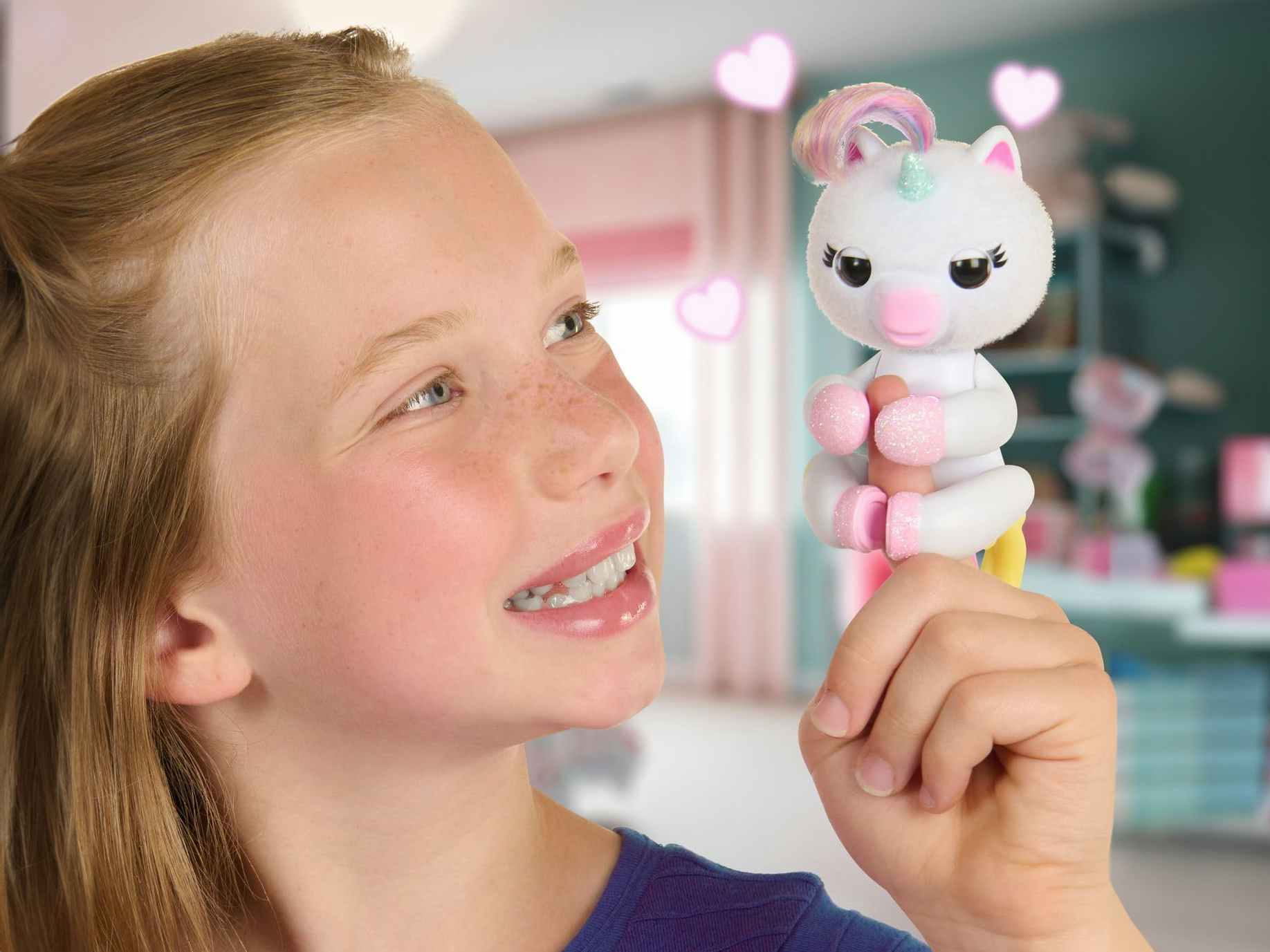 a child playing with a unicorn fingerling