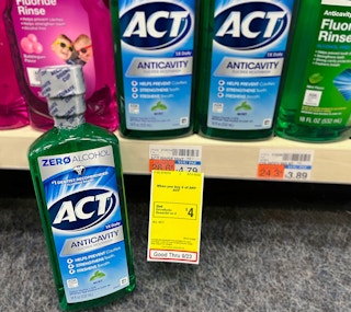 bottle of ACT mouthwash next to sales tag