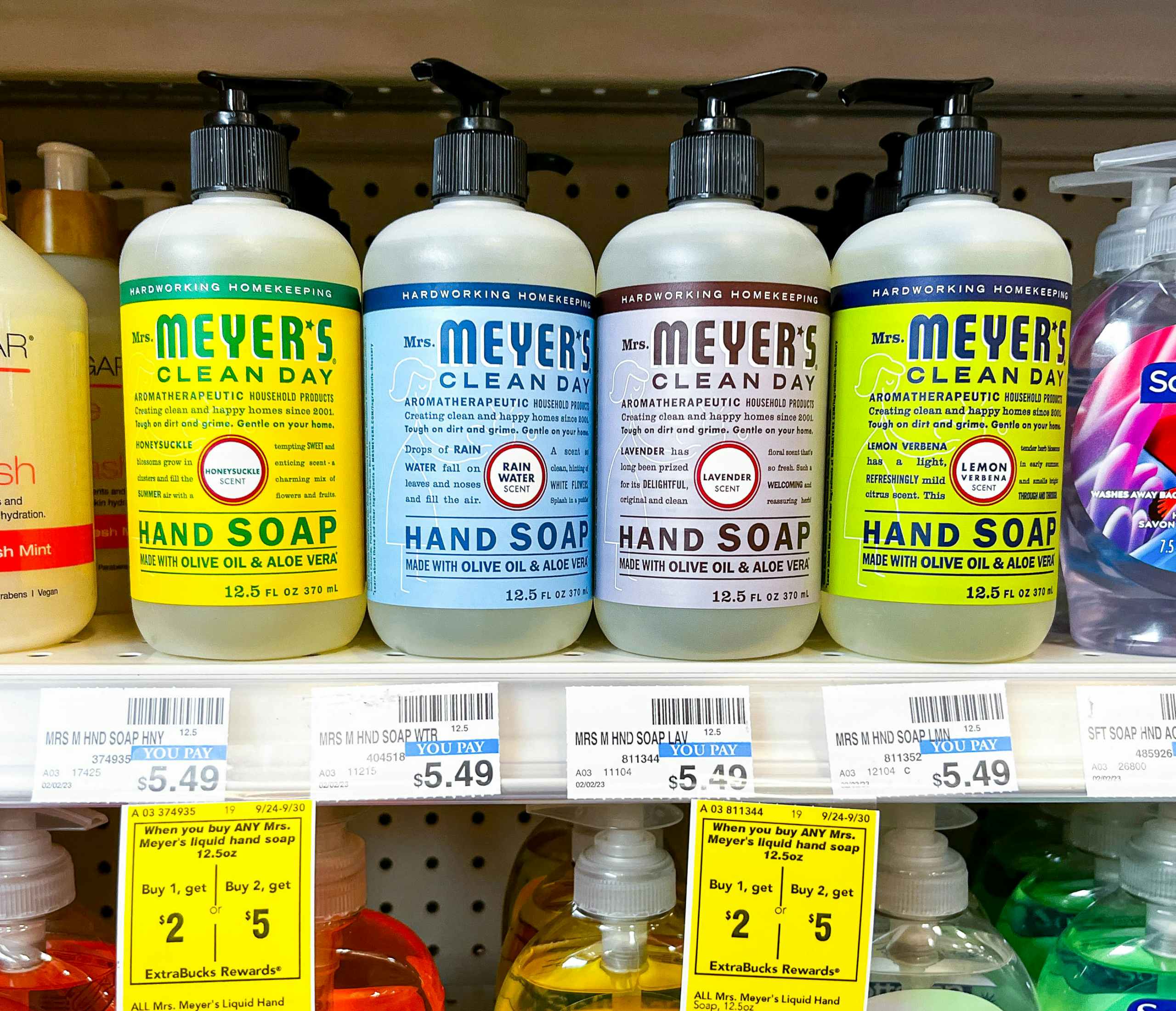 Mrs. Meyers hand soaps on shelf with sales tag underneath
