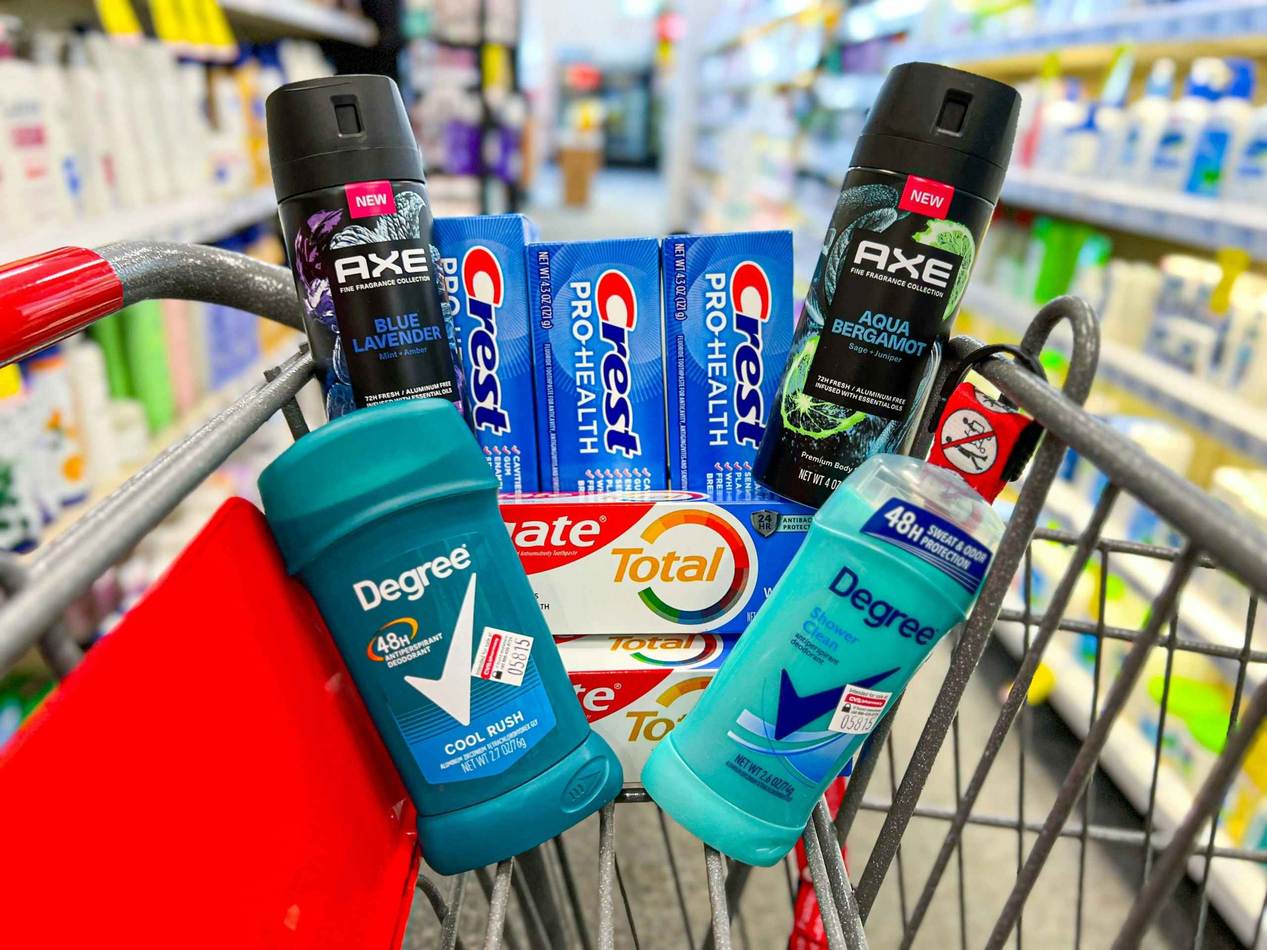 two Axe body sprays, two Degree deodorants, three Crest toothpastes, and two Colgate toothpaste in shopping cart