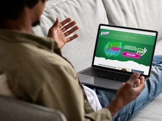 a person on their laptop looking at extra gums hotline website