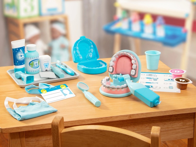 a Melissa and Doug Dentist Play set on a table