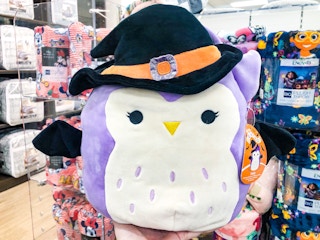 Halloween squishmallow in hand