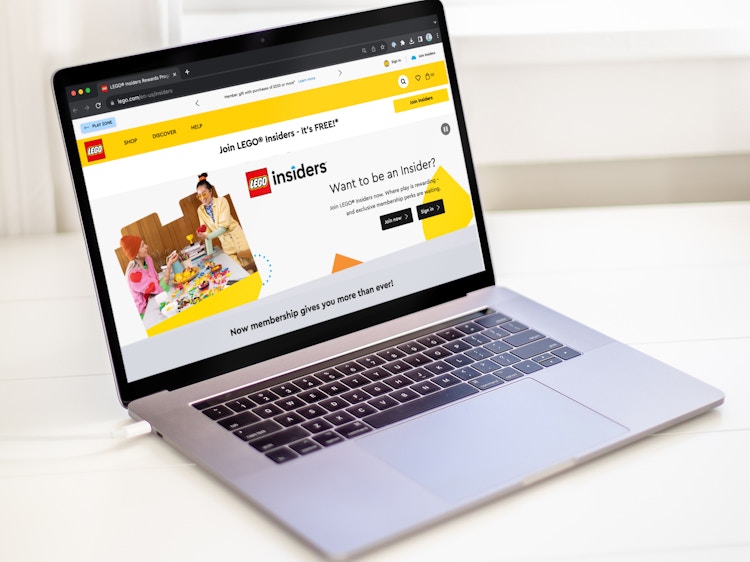 a laptop displaying the Lego Insiders webpage on the Lego website