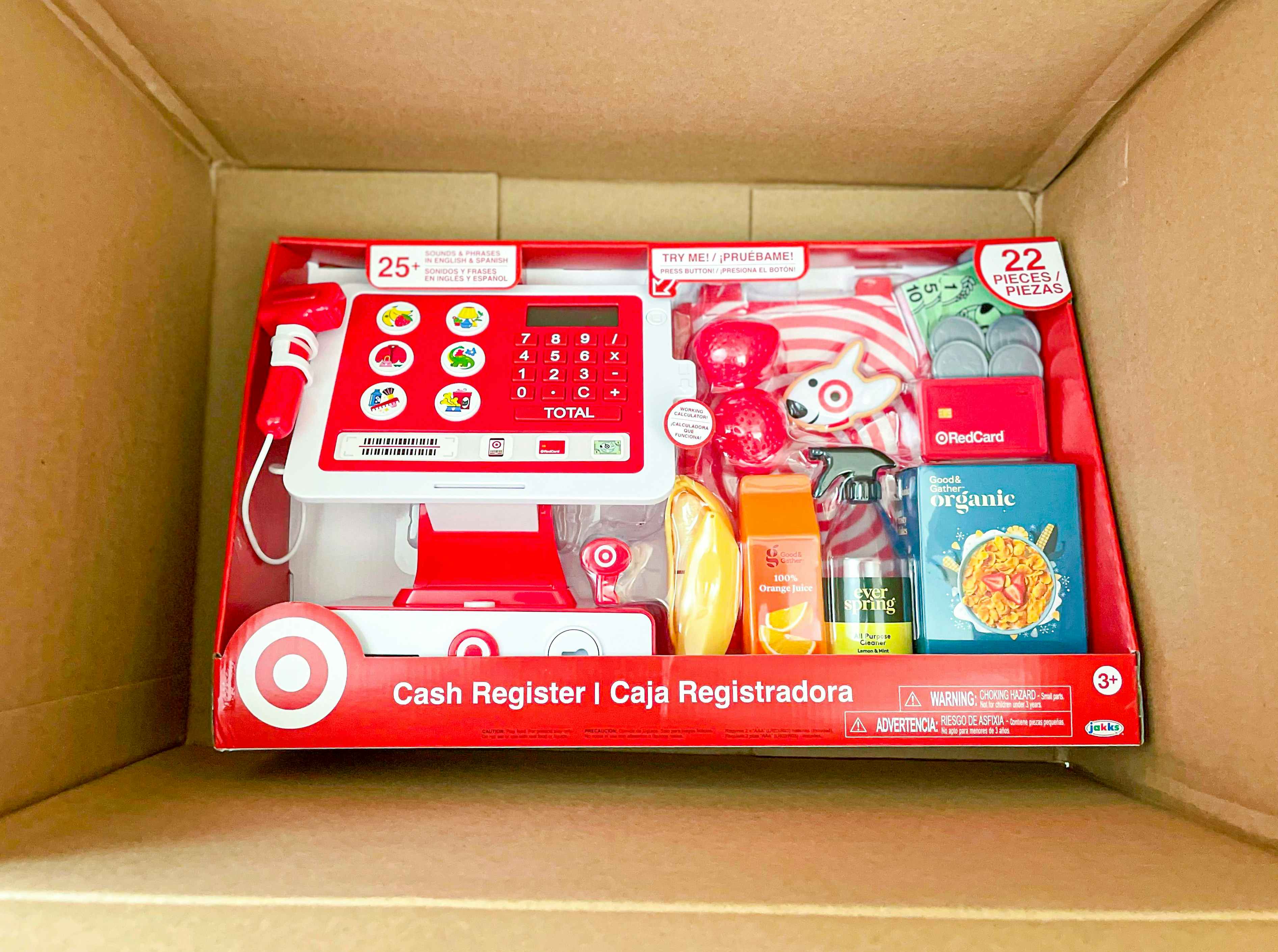 Cash register toy inside a cardboard box