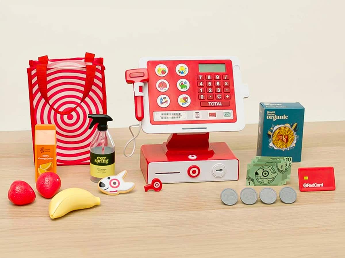 the Target cash register toy with accessories set up on a table