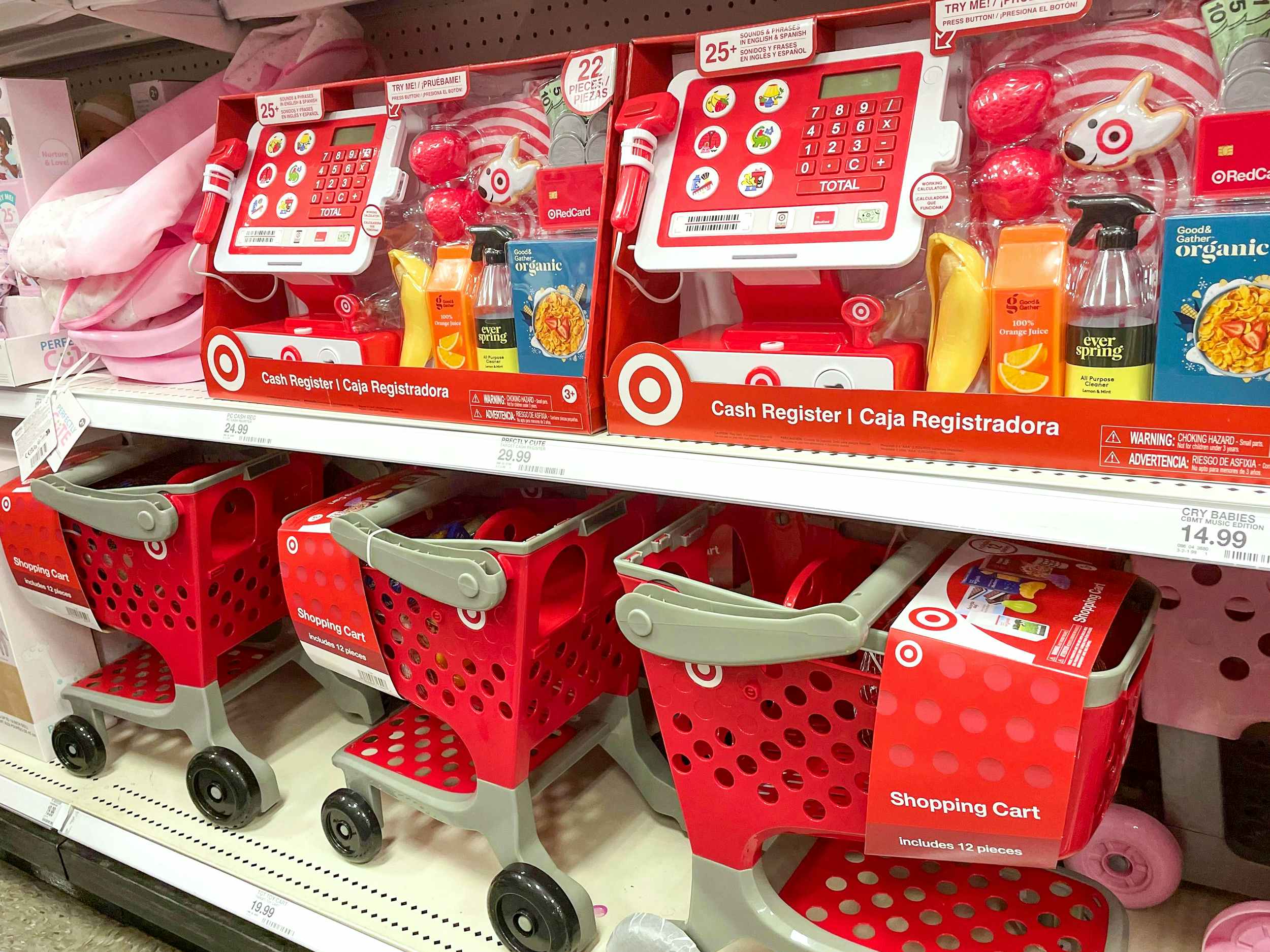 target cash registers and shopping cart toys on store shelves