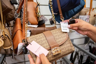 Hand holding a juicy couture bag