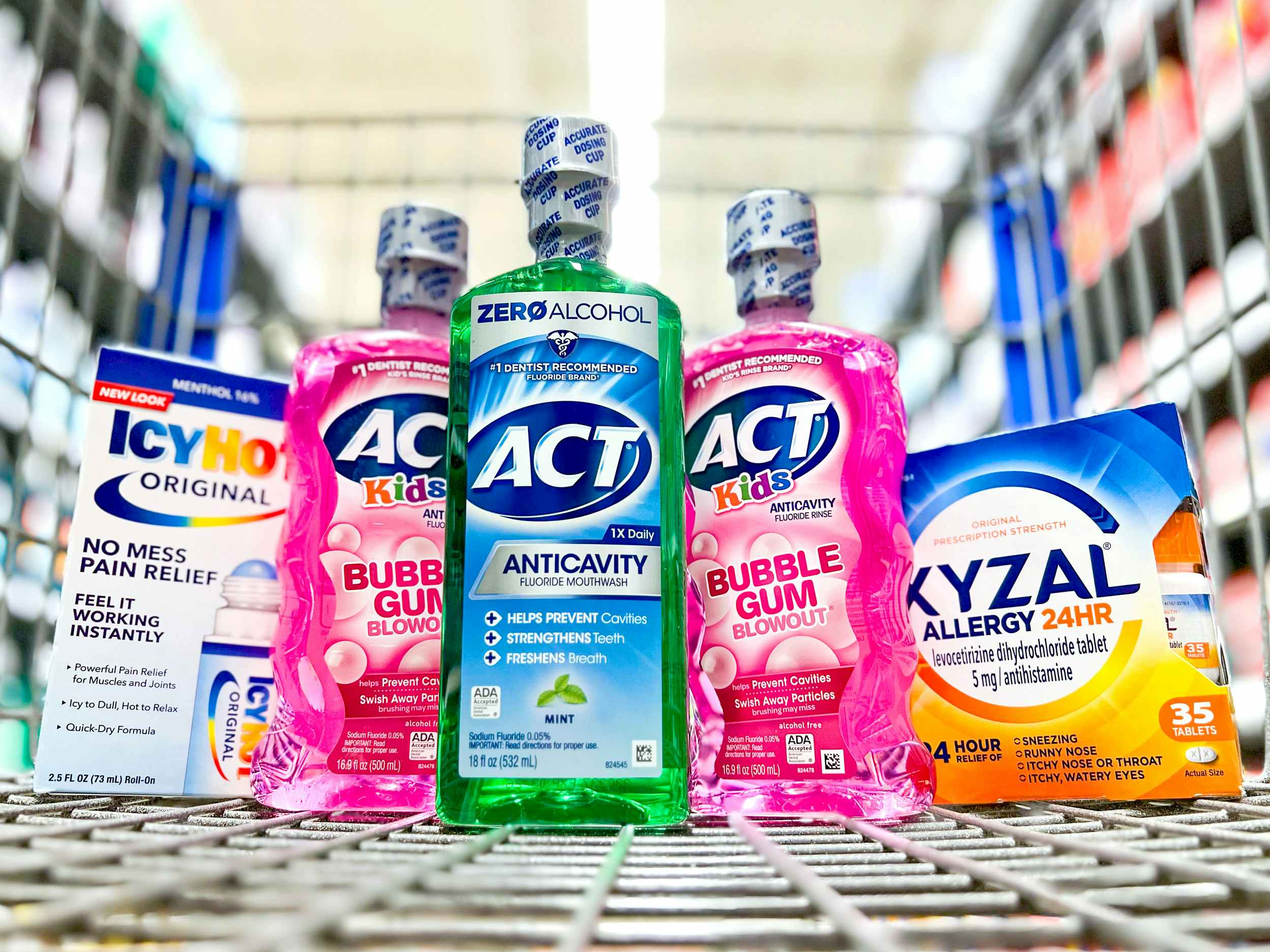 icy hot original, act kids and anticavity outhwash, and xyzal allergy in walmart shopping cart