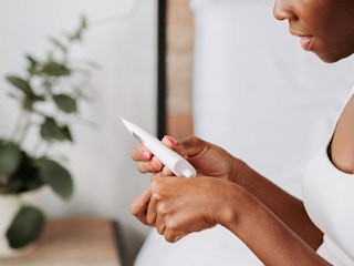 person applying hand cream