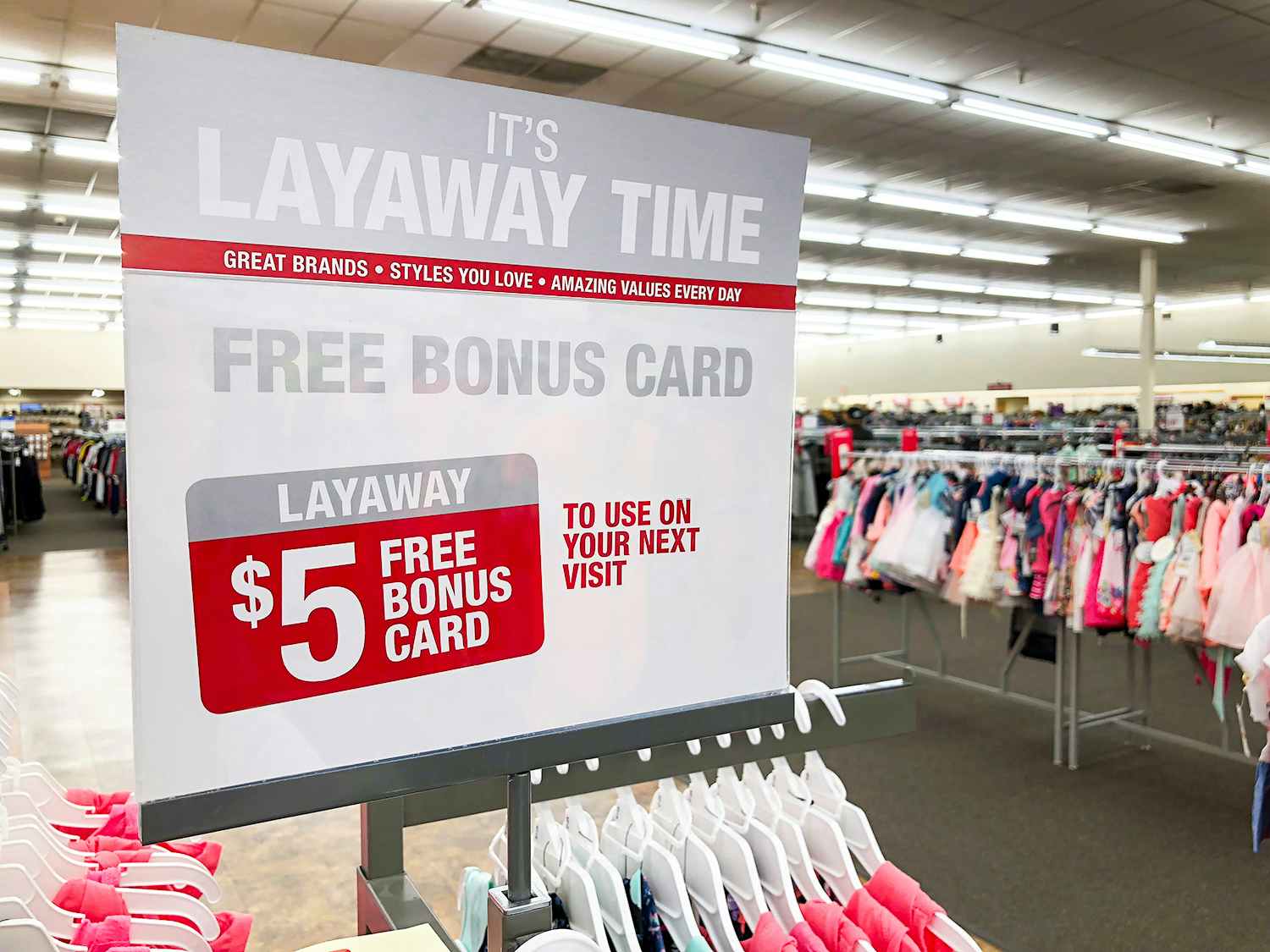 a sign for layaway offering a bonus card